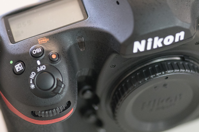 Close-up of the top front of a Nikon Digital camera